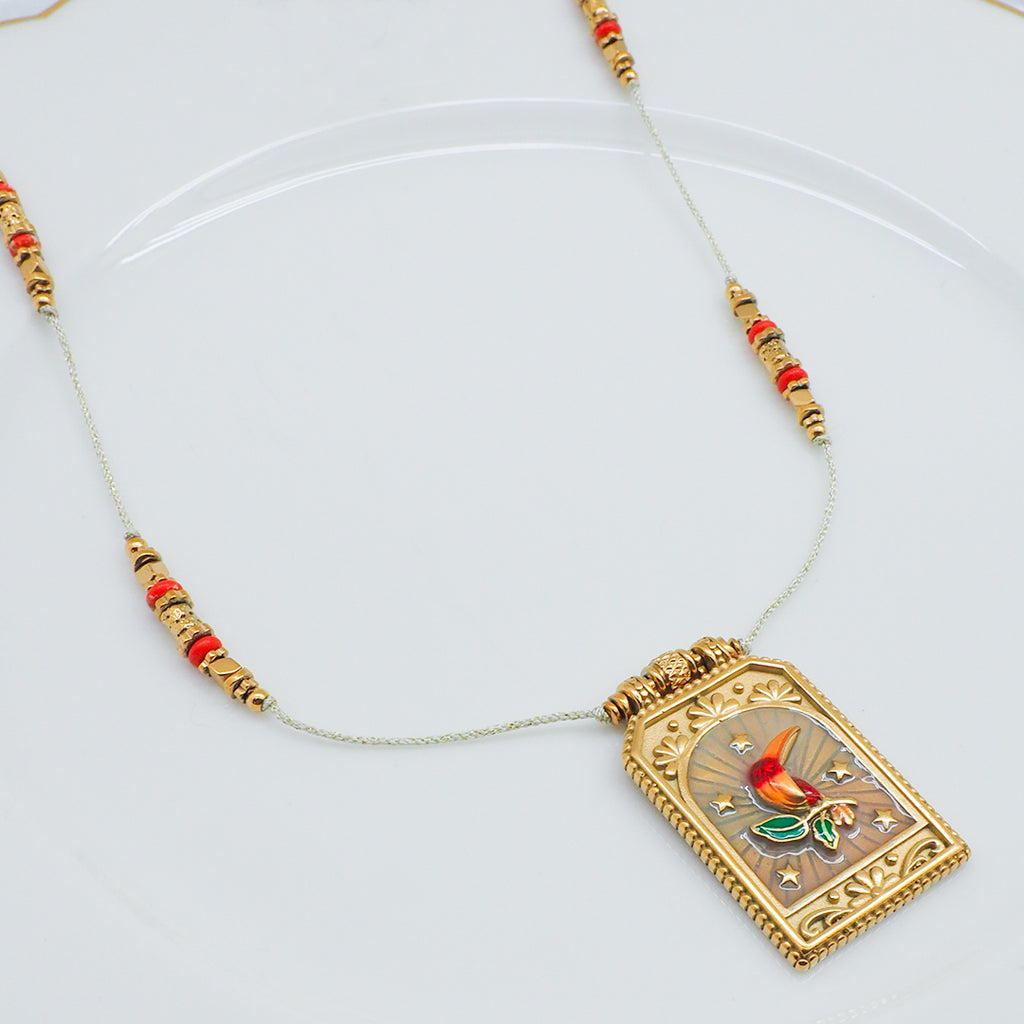 COLLIER TUCAN - SAUTOIR TOUCAN SUR PLAQUE DORÉE