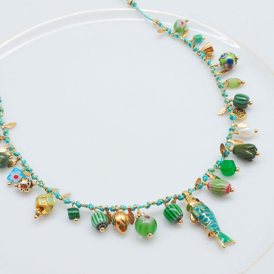 COLLIER FOLIADA - CHARMS TURQUOISES SUR CORDON TRESSÉ