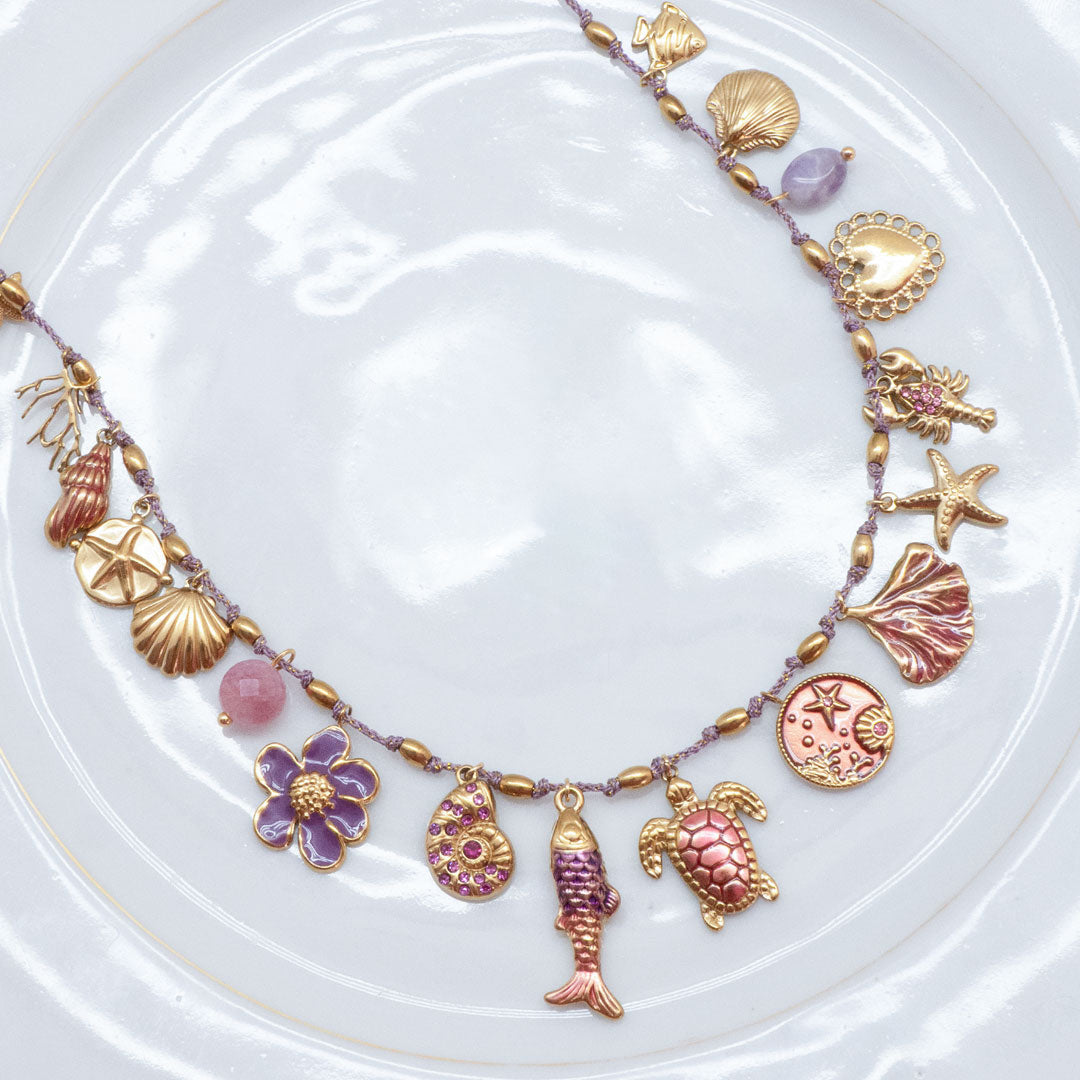 COLLIER NOIA - CHARMS MARINS SUR CORDON TRESSÉ